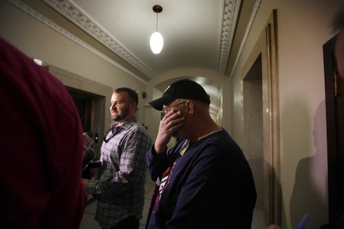 RUTH BONNEVILLE / WINNIPEG FREE PRESS

Robin Milne, 60, from Sprague, Man., sheds some tears of joy while talking to the media inside the Manitoba Legislative Building today after finding out that his medical bill of over $100,000 that he incurred while suffering a heart attack and being taken to a US facility for treatment.  
His son Kevin Milne is next to him in photo.  
See Nick Martin story. 
 March 09, 2017