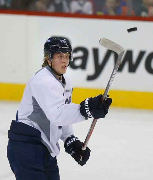 WAYNE GLOWACKI / WINNIPEG FREE PRESS

Winnipeg Jets player Patrik Laine  #29  plays with airborne puck during a break at the teams practice in the MTS Centre Friday. Mike Sawatzky story  March 10    2017