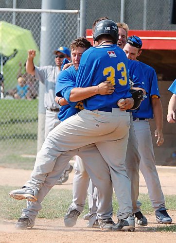 BORIS MINKEVICH / WINNIPEG FREE PRESS  080927 St. Boniface Legionaires players celebrate after #33 Evan Hardman scores the winning run against Elmwood.