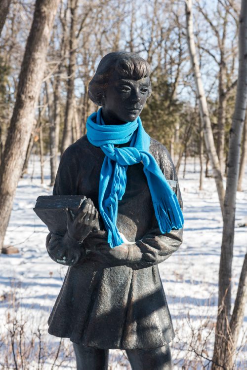 DAVID LIPNOWSKI / WINNIPEG FREE PRESS

Even the sculptures need to bundle up, including "School Girl" Friday March10, 2017 at the Leo Mol Sculpture Garden at Assiniboine Park