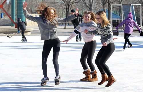 RUTH BONNEVILLE  / WINNIPEG FREE PRESS

Gymnasts Rhea Salvaggio (left) Hope McWhinney (centre) and Unje Lika (right, sweater) goof around on the skating pond under the canopy while at Forks Saturday.  
Saturday

  March 11, 2017