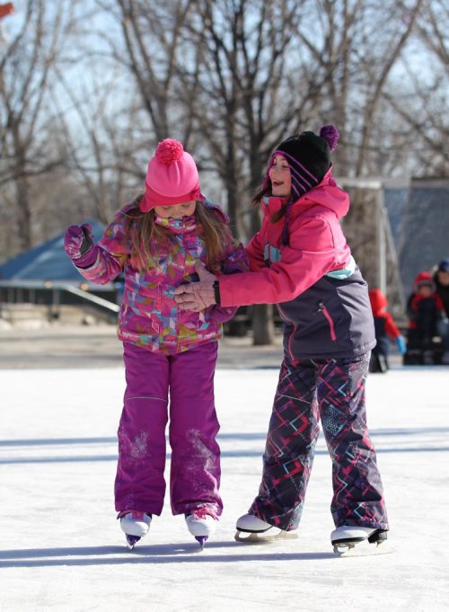 RUTH BONNEVILLE  / WINNIPEG FREE PRESS

Lexy Christie (8yrs) giggles as she skates with her little sister Paig (5yrs), under the canopy at the Forks while hanging out with their grandparents Saturday. 
Standup  
  March 11, 2017