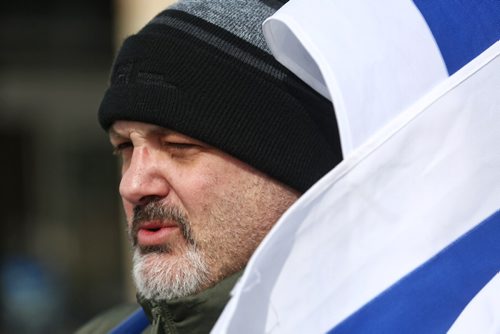 MIKE DEAL / WINNIPEG FREE PRESS
Organizer, Ron East carries an Israeli flag during the rally with about thirty others in front of the Rady JCC Sunday afternoon.
170312
Sunday, March 12, 2017