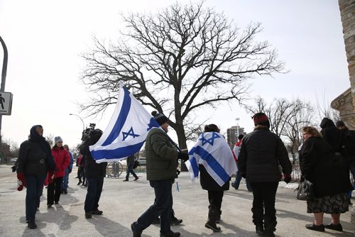 MIKE DEAL / WINNIPEG FREE PRESS
About thirty people came together with Israeli flags to join a the rally to protest anti-Semitism in front of the Rady JCC Sunday afternoon.
170312
Sunday, March 12, 2017