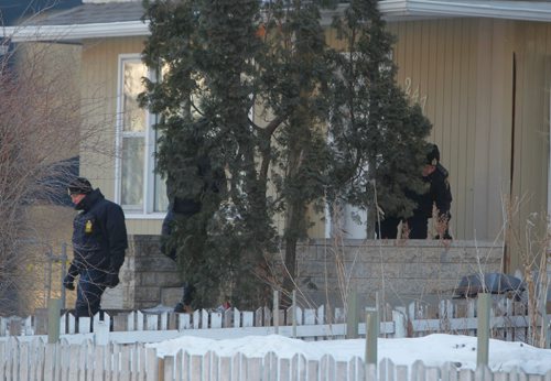 BORIS MINKEVICH / WINNIPEG FREE PRESS
Police and Forensic Unit members at the crime scene in the 200 block of Spence Street this morning. March 13, 2017 170313