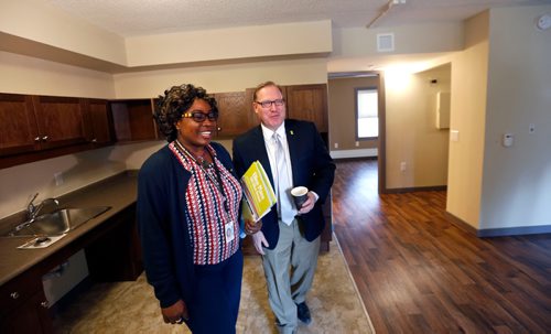 WAYNE GLOWACKI / WINNIPEG FREE PRESS

 Titi Tijani, Manager of Tenant Services gives Families Minister Scott Fielding a tour Monday of a  suite at the grand opening of Ellice Place, an assisted living facility for seniors.  Families Minister Scott Fielding announced Ellice Place at 555 Ellice Ave, that combines social housing and assisted living services for seniors in Winnipeg has completed their  $11-million renovation. All 118 studio and one-bedroom units have been fully renovated, including five fully-accessible units for individuals with disabilities. Tenants are scheduled to move in on April 3.
see  provincial news release March 13    2017