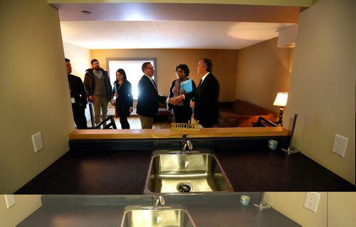 WAYNE GLOWACKI / WINNIPEG FREE PRESS

 In centre, Titi Tijani, Manager of Tenant Services gives Families Minister Scott Fielding and Réal Cloutier, vice-president and  CEO, WRHA at right a tour Monday of a one bedroom suite at the grand opening of  Ellice Place, an assisted living facility for seniors.  Minister Scott Fielding announced Ellice Place at 555 Ellice Ave, that combines social housing and assisted living services for seniors in Winnipeg has completed their  $11-million renovation. All 118 studio and one-bedroom units have been fully renovated, including five fully-accessible units for individuals with disabilities. Tenants are scheduled to move in on April 3.
see  provincial news releaseMarch 13    2017