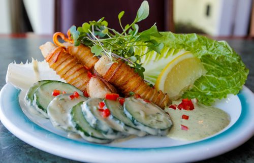 BORIS MINKEVICH / WINNIPEG FREE PRESS
RESTO REVIEW - The Village Diner at 510 Sargent Ave. Here the pickerel fingers wrapped in spiralized crisp potatoes are plated with fresh cukes. March 13, 2017 170313