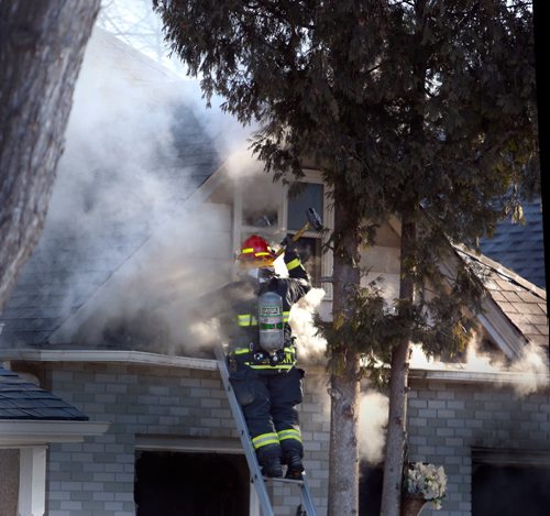 WAYNE GLOWACKI / WINNIPEG FREE PRESS

Winnipeg Fire Fighters battle a house fire in the 400 block of Aberdeen Ave. near Powers St. Tuesday morning. One person was taken to the hospital.  March 14    2017