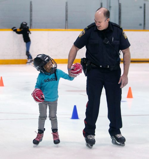 WAYNE GLOWACKI / WINNIPEG FREE PRESS

Oreana, a young student at Dufferin Elementary School gets a helping hand from Police Const. Gael Jacob, she was one of the about 50 skaters that took part in the Dufferin Hockey/Learn to Skate Program s windup that held Wednesday at the Pioneer Arena to showcase the skills they have learnt. This community based programs main goal is to keep youth engaged in a positive and healthy atmosphere. Together the Winnipeg Police Service and Police Cadets partnered with the Dufferin Elementary School, Hugh John MacDonald Junior High, Pinkham Elementary and Freight House and have helped make the program successful for the fifth year. March 15    2017