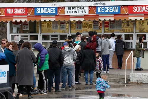 JOHN WOODS / WINNIPEG FREE PRESS People line up to get the first taste of summer at the Bridge Drive-In (BDI) Sunday, March 19, 2017. BDI opened today for the season.