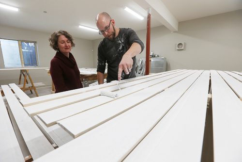 JOHN WOODS / WINNIPEG FREE PRESS
Sally Nelson, interim director of Naomi House, looks on as volunteer Chad Fehr paints some baseboards at Naomi House, a transitional Housing project for up to 18 asylum seekers Monday, March 20, 2017. They plan to open in May.