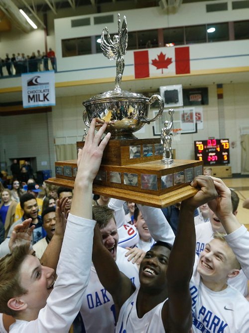 JOHN WOODS / WINNIPEG FREE PRESS
Oak Park Raiders celebrate a defeat of the St Paul's Crusaders in the Manitoba High School 2017 Varsity Boys Basketball Championship at the University of Manitoba Monday, March 20, 2017.