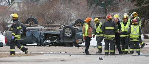 WAYNE GLOWACKI / WINNIPEG FREE PRESS

 Emergency personnel at the scene of a two vehicle collision on Grant Ave. at Lilac St. Wednesday morning after extracting a person from the vehicle in back.  The the two vehicle collision  has closed Grant Ave. in both directions as police investigate the scene. March 22    2017