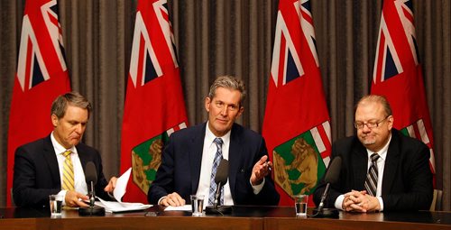 PHIL HOSSACK / WINNIPEG FREE PRESS  -  Left to right, Manitoba's Finance Minister Cameron Friesen,  Premier Brian Pallister and Health Minister Kelvin Goertzen react to the Federal Liberal budget Wednesday at the Provincial Legislature.  -  March 22, 2017