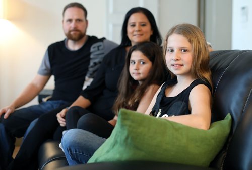 JASON HALSTEAD / WINNIPEG FREE PRESS

Hailey Valenta, 11, (right) fell ill while travelling on a recent vacation to Disney World in Florida with sister Makaila, 9, and her parents, Anna and Pavel, but the family was covered by travel health insurance. The Valentas were photographed at their home in northwest Winnipeg on March 23, 2017. A recent survey revealed many Canadians may travel without proper health insurance coverage. (See Money Matters story)