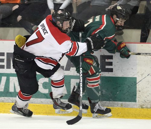 JASON HALSTEAD / WINNIPEG FREE PRESS

Winnipeg Warriors player Cory Chrapun tries to beat Winnipeg Monarchs player Bowan Spence along the boards during Game 7 of the AAA midget hockey city final series on March 23, 2017 at the MTS Iceplex. The Monarchs won the title.