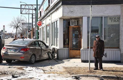 MIKE DEAL / WINNIPEG FREE PRESS

A vehicle sits on the sidewalk in front of Cafe ce Soir on Portage Avenue at Banning Street after two car collision Sunday afternoon. No word on injuries. 

170326
Sunday, March 26, 2017