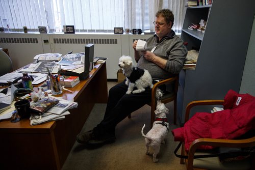 MIKE DEAL / WINNIPEG FREE PRESS
Doug Spiers and Shannon Sampert talk about their dogs for Doug's column while Shannon's dog Norman sits on Doug's lap with Bogey at his feet. The Free Press is starting an experiment, allowing employees to bring their dog into work. 
170320 - Monday, March 20, 2017.