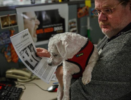 MIKE DEAL / WINNIPEG FREE PRESS
Winnipeg Free Press humour columnist Doug Spiers with Bogey in the newsroom. The Free Press is starting an experiment, allowing employees to bring their dog into work. 
170320 - Monday, March 20, 2017.