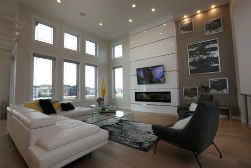 WAYNE GLOWACKI / WINNIPEG FREE PRESS

Homes.   The livingroom in the great room at 20 Clear Spring Road in Bridgwater Lakes. The KDR Homes sales rep Josie Garofoli. Todd Lewys story    March 27    2017