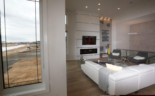 WAYNE GLOWACKI / WINNIPEG FREE PRESS

Homes.   The view from the great room at 20 Clear Spring Road in Bridgwater Lakes. The KDR Homes sales rep Josie Garofoli. Todd Lewys story    March 27    2017