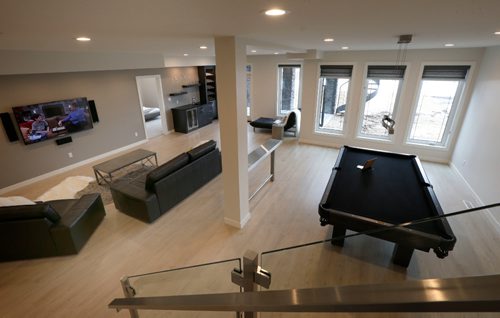 WAYNE GLOWACKI / WINNIPEG FREE PRESS

Homes.   The lower level at 20 Clear Spring Road in Bridgwater Lakes. The KDR Homes sales rep Josie Garofoli. Todd Lewys story    March 27    2017