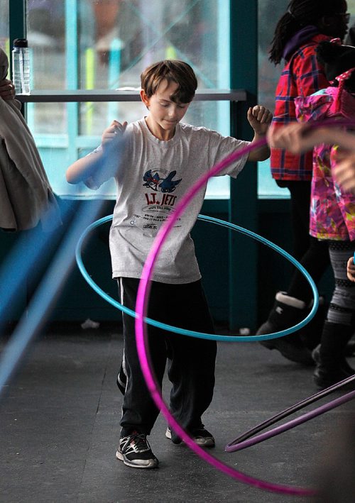 PHIL HOSSACK / WINNIPEG FREE PRESS  -  Ten yr old Nolan Kozakowski works a hula hoop around his waist Monday afternoon t the Forks Market. As part of Spring Break festivities at the Forks, he was taking part in a Festival of Fools, put on by the International Children's Festival. See release STAND-UP.  -  March 27, 2017