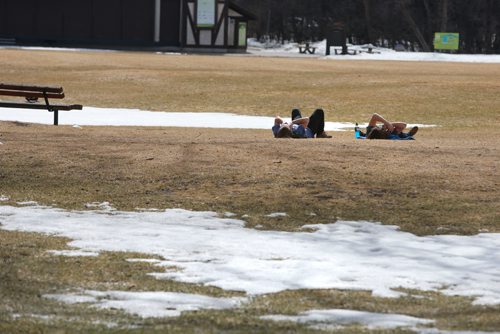 WAYNE GLOWACKI / WINNIPEG FREE PRESS

At right, Devon Liscum and Michael Haines enjoy their day off from work Tuesday relaxing in Assiniboine Park after tossing a football.   Randy Turner story March 28    2017
