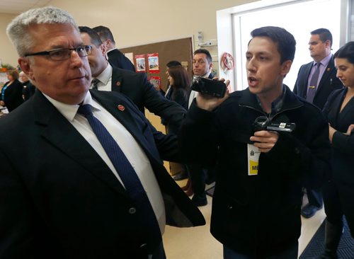 WAYNE GLOWACKI / WINNIPEG FREE PRESS
A protester at right is escorted out by RCMP from Prime Minister Justin Trudeau's child care announcement at the South Y in Winnipeg Wednesday.¤¤Larry Kusch story March 29 2017