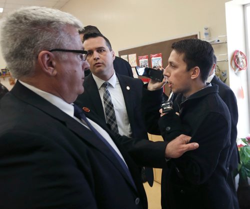WAYNE GLOWACKI / WINNIPEG FREE PRESS

A protester at right is escorted out by RCMP from Prime Minister Justin Trudeau's child care announcement at the South Y in Winnipeg Wednesday.¤¤Larry Kusch story March 29    2017