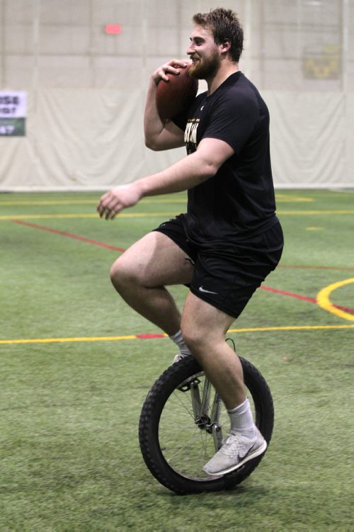 RUTH BONNEVILLE  / WINNIPEG FREE PRESS

 Bison Geoff Gray goofs around as he rides his unicycle around the Subway Soccer South Indoor Soccer Complex  after working out  with scouts from the NFL during his pro day football workout at  University of Manitoba Thursday.
  
Gray is the second Manitoba Bisons to hold a pro day football workout and is back-to-back years that a pro day has occurred (David Onyemata in 2016).

March 30, 2017