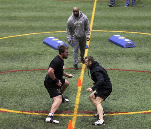 RUTH BONNEVILLE  / WINNIPEG FREE PRESS

 Bison Geoff Gray works out at Subway Soccer South Indoor Soccer Complex  with Packers College Football scout Alonzo Dotson  (grey hoodie) during his NFL  pro day football workout at  University of Manitoba Thursday.  
Gray is the second Manitoba Bisons to hold a pro day football workout and is back-to-back years that a pro day has occurred (David Onyemata in 2016).

March 30, 2017