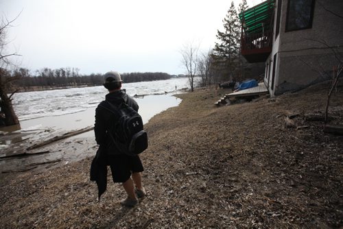 RUTH BONNEVILLE  / WINNIPEG FREE PRESS

 A family member of a homeowner on Cloutier Drive in St. Norbert is shocked when he takes a look at how high the water has risen in his parents back yard Thursday afternoon.  The City of Winnipeg dropped off 1200 sandbags onto their property with another 1200 on roadside.  
See Randy Turner story.  
March 30, 2017