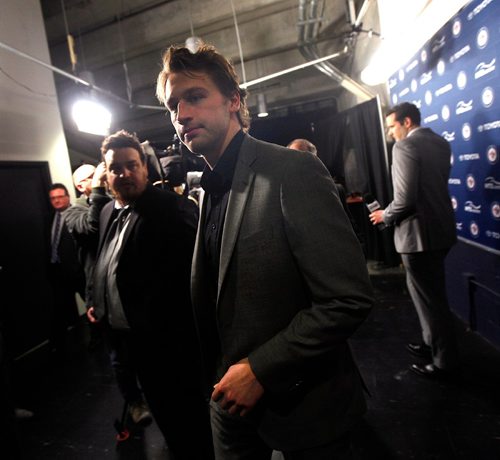 PHIL HOSSACK / WINNIPEG FREE PRESS  -  Tucker Poolman, new Jet exits a presser before the Jets game Thursday. See story.  -  March 30, 2017