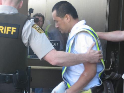 Suspect Vince Li is escorted from provincial court in Portage la Prairie Tuesday August 5/08.  Mike McIntyre/Winnipeg Free Press