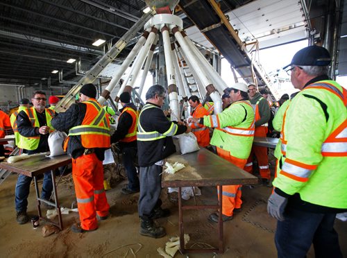 RUTH BONNEVILLE  / WINNIPEG FREE PRESS

City of Winnipeg workers fill and stack sandbags to be delivered to homes along the river at their east Yards Complex off Nairn Thursday.  
 
March 31, 2017