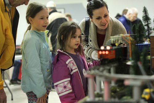 RUTH BONNEVILLE  / WINNIPEG FREE PRESS

Emily Oliver (8yrs) her sister Adalyn (5yrs) watch a model train go through a tunnel with their mom Michelle at The Winnipeg Model Railroad Club annual open house taking place at Charleswood  Legion Saturday.  
Standup photo 


April 01, 2017