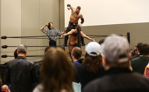 MIKE DEAL / WINNIPEG FREE PRESS
Members of the Canadian Wrestling's Elite organization, Travis "Tasty" Cole in blue shorts and Anderson "A-List" Tyson Moore in black put on a wrestling demonstration during the Manitoba Comic Con at the convention centre Sunday afternoon.
170402 - Sunday, April 02, 2017.