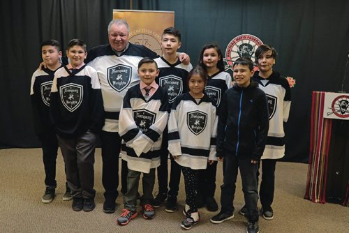 Canstar Community News David Chartrand (third from left to right), president of the Manitoba Metis Federation, with the Norquay Knights hockey players on Mar. 23, 2017.