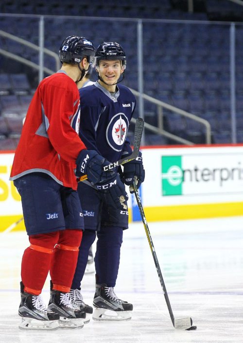 MIKE DEAL / WINNIPEG FREE PRESS
Winnipeg Jets' Jack Roslovic (52), right,  chats with Nelson Nogier (62) during practice at the MTS Centre Monday morning. 
170403
Monday, April 03, 2017