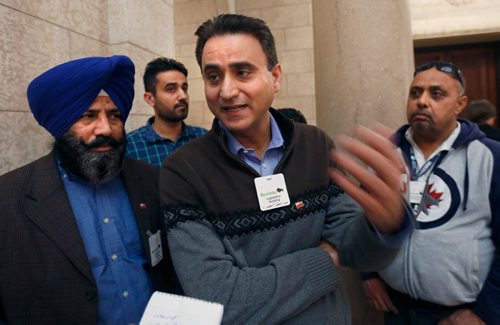 WAYNE GLOWACKI / WINNIPEG FREE PRESS

In centre, Randy Chhokar with fellow cab drivers after question period in the Manitoba Legislature Monday. Nick Martin/Larry Kusch  stories  April 3     2017