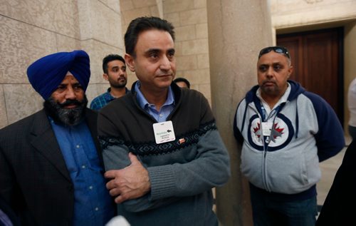 WAYNE GLOWACKI / WINNIPEG FREE PRESS

In centre, Randy Chhokar with fellow cab drivers after question period in the Manitoba Legislature Monday. Nick Martin/Larry Kusch  stories  April 3     2017