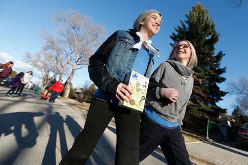 JOHN WOODS / WINNIPEG FREE PRESS
Guides Katrina McKnight and Angelina Morris head out to sell cookies door to door in Windsor Park Monday, April 3, 2017. 2017 is the 90th anniversary of Guides Canada