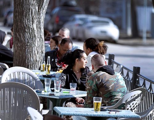 PHIL HOSSACK / WINNIPEG FREE PRESS  -  It's official.....Corydon ave Patio's hosted Winnipeggers Tuesday as sun and warmer temps thawed the city again. Forecast for tomorrow is a mix of sun and cloud with a high of 8C.  -  April 4, 2017
