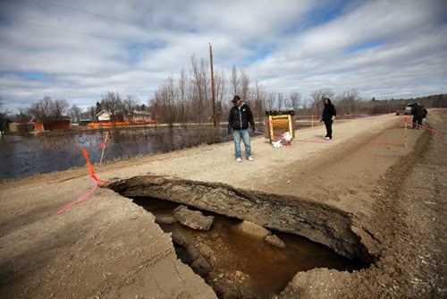 RUTH BONNEVILLE  / WINNIPEG FREE PRESS

Feature on Peguis First Nation Feature on ongoing flooding issues.
Peguis First Nation resident stands next to roadway that has collapsed due to high water and overland flooding on reserve.  

April 04, 2017