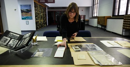 MIKE DEAL / WINNIPEG FREE PRESS
Kathleen Epp, senior archivist looks through some of the items that will be on display next Wednesday.
On Wednesday, April 12, the Archives of Manitoba will be holding an open house to commemorate the 100th Anniversary of The Battle of Vimy Ridge by putting on display many letters and paper documents that have found their way into the archives collection.
170405 - Wednesday, April 05, 2017.