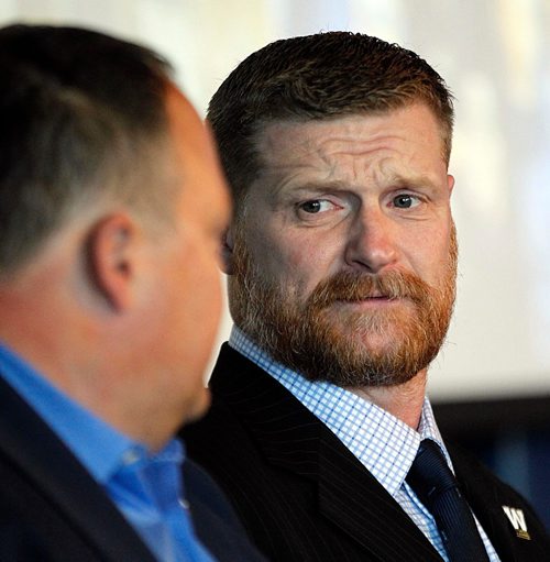 PHIL HOSSACK / WINNIPEG FREE PRESS  -  Blue Bomber coach Mike O'Shea trades glances with Wade Miller as Bomber fan faithful and alumni gathered at Investors Group Field Wednesday evening to hear a report from team leadership. See story?   -  April 4, 2017