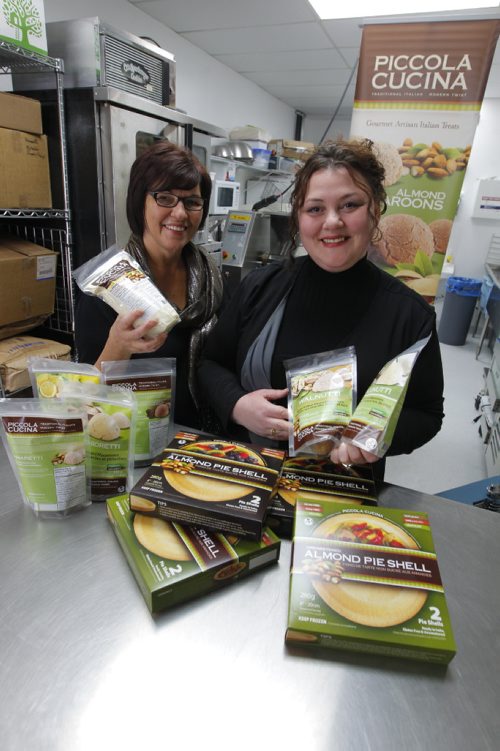 BORIS MINKEVICH / WINNIPEG FREE PRESS
Photo of the mother-and-daughter team of (from left) Anita and Pina Romolo, are co-owners of Piccola Cucina, an eight-year-old Winnipeg firm which manufacturers Italian gourmet products made from almonds. They just signed a deal with a B.C.-based food distributor (Canadian Choice Wholesalers) who will be distributing their products to about 100 new stores in Western Canada. The deal is expected to enable them to double and maybe even triple their sales in 2017. (Their products include Italian macaroons, almond flour, and pie and tart shells made with almond floor). Murray McNeill story. April 6, 2017 170406