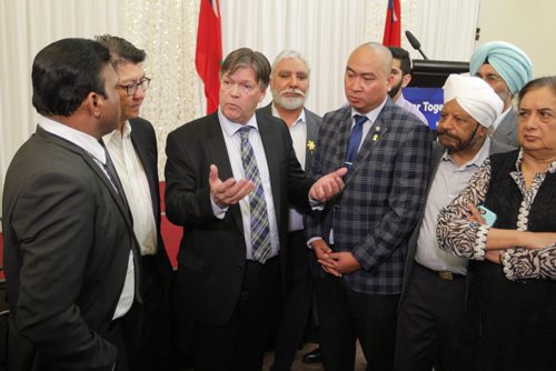 BORIS MINKEVICH / WINNIPEG FREE PRESS
Manitoba Provincial nominee Program announcement at Punjab Cultural Centre, 1770 King Edward St.
Third from left, Education and Training Minister Ian Wishart talks to people with more questions after the announcement. 5th from left Jon Reyes/MLA St. Norbert listens.CAROL SANDERS STORY. April 6, 2017 170406